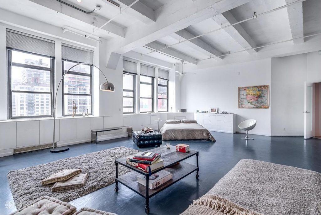 Live/work loft with an eight-foot wall of windows asks $4,950/month in Midtown West