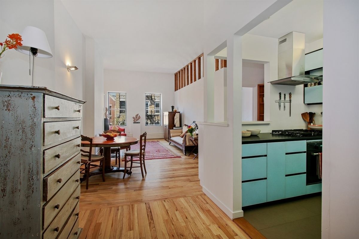 $1.2M East Village condo has a cool blue kitchen and a roof deck with a view