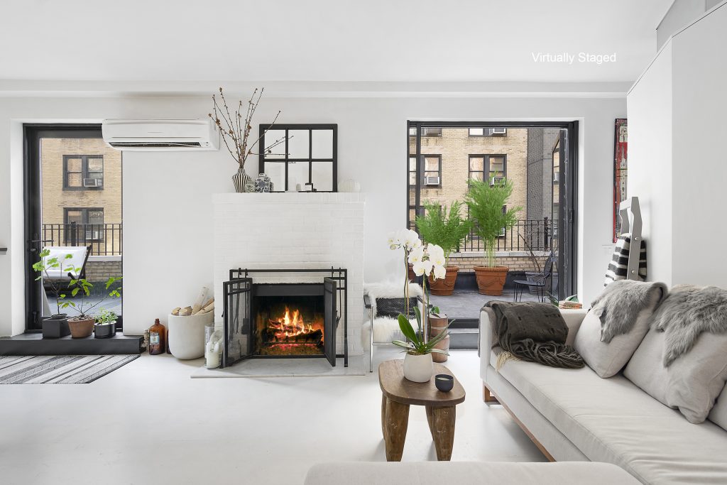 Mod Midtown West penthouse with an enormous wraparound terrace seeks just under $1M