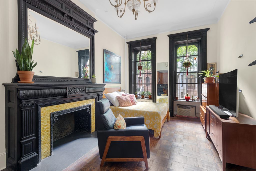 Studio with an elaborately carved fireplace and prime UWS location asks $529K