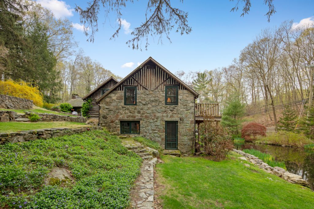 Every day could be a camping adventure at this $998K Connecticut log and stone country home